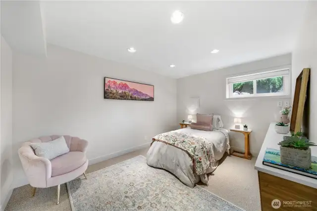 Spacious lower level room that can serve as a 4th bedroom or office with built-ins.