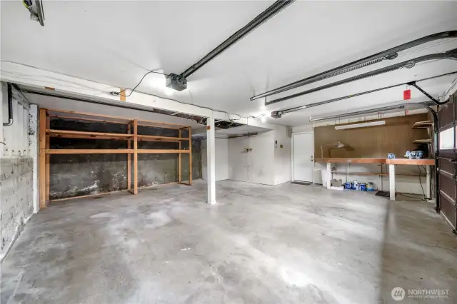 Large attached 2-car garage with tons of space for extra storage & tools.