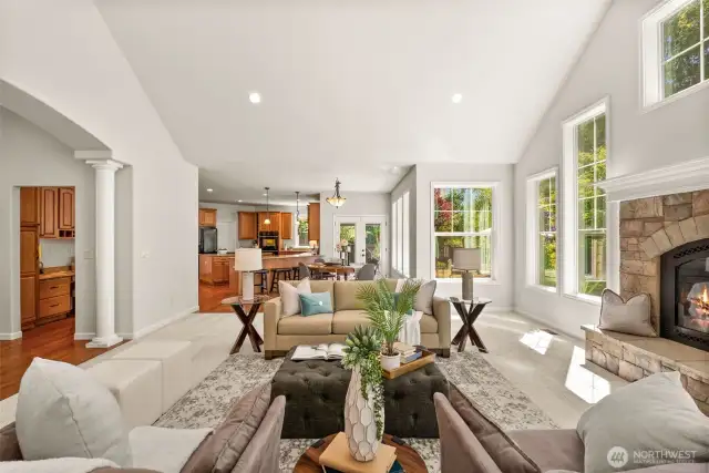 Beautiful arched entryways, detailed millwork, and stately pillars bring a sense of sophistication and timeless traditional charm to the space.