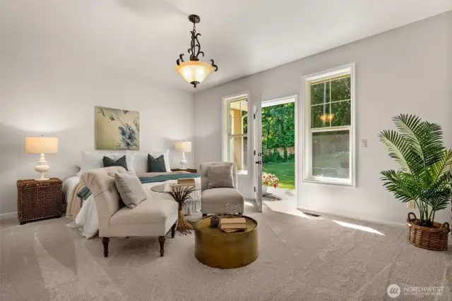 Savor the beauty of this serene primary bedroom, complete with private patio access for your own peaceful retreat.