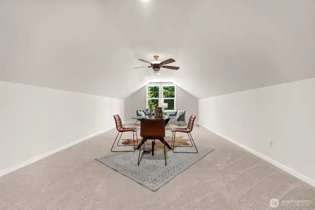 The spacious upper-level bonus room is ideal as a media room or a quiet retreat, thoughtfully set apart from the main living area.