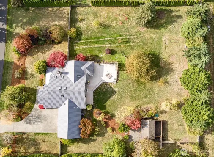 Ariel Birds Eye View of Property including Garden shed with electricity & Garage door for riding mower. Large primarily level backyard, Large over 1 acre lot.