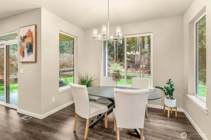 Generously sized ewating area with beautiful views of the surrounding forest