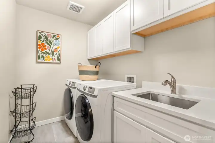 Laundry room is conveniently located on the upper level- no need to lug laundry up and down stairs!