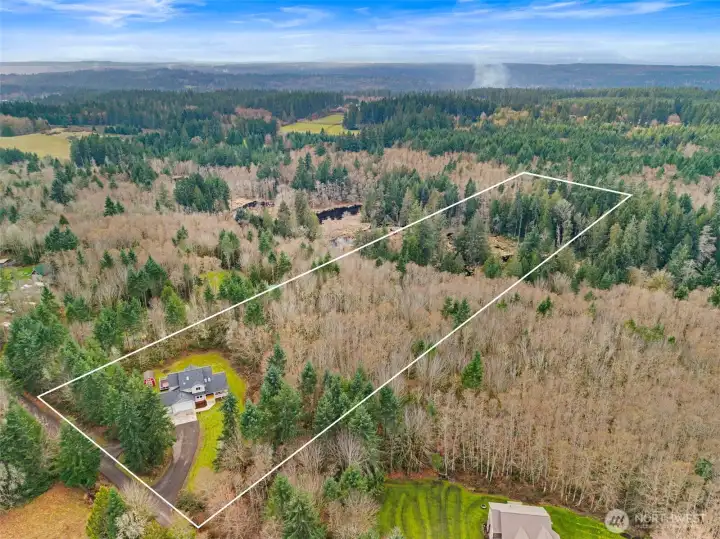 Privately nestled among the trees on 8.79 serene acres at the northern end of the Kitsap Peninsula.