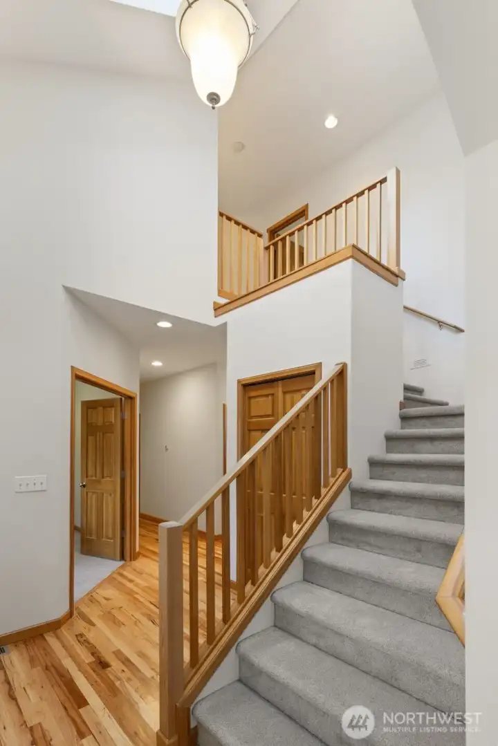 Step inside to soaring vaulted ceiling and light-filled living spaces that create an inviting, airy atmosphere.