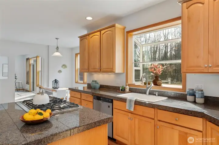 Integrated kitchen design with an adjoining casual dining space.