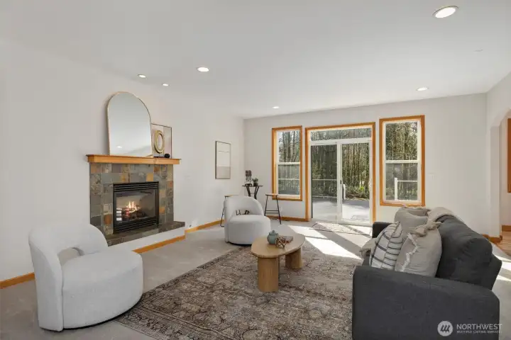 Cozy up in the spacious family room, highlighted by a beautiful slate gas fireplace that creates a warm and welcoming atmosphere.