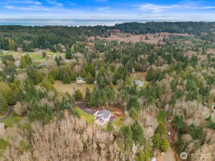 Aerial view showcasing Puget Sound to the north and east of the home. Home located just 3.5 miles from the Kingston Ferry Terminal for easy access to Seattle & Edmonds.