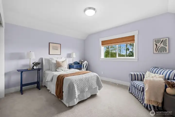 Spacious upper bedroom ideal for guests or office