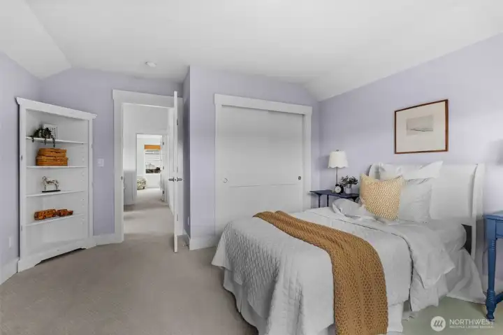 Comfortable upper bedroom with soft natural light