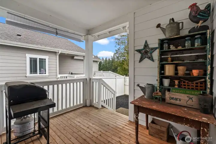 Covered porch space for outdoor dining or grilling