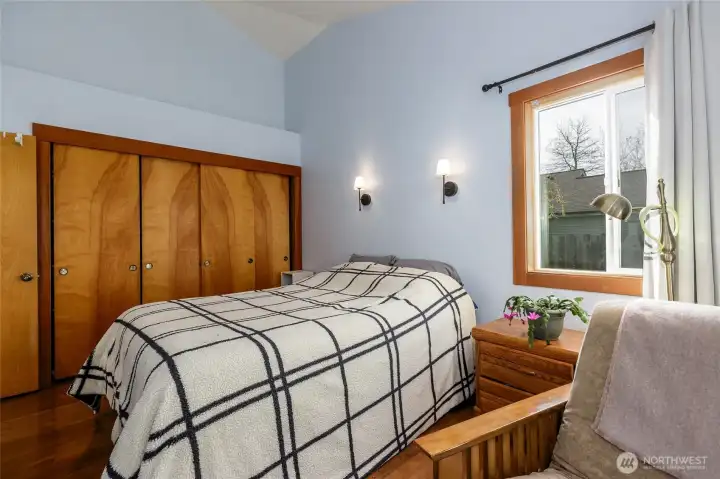 Serene bedroom with a sunroof overhead — perfect for enjoying soft morning light or stargazing at night.