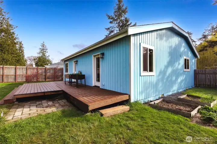 Newly remodeled back deck with plenty of space for outdoor dining and relaxation.