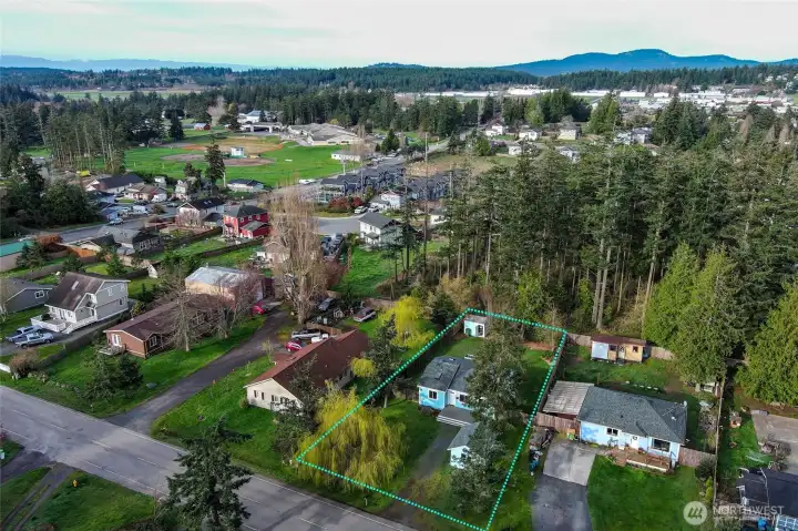 Bright aerial shot featuring the home and the surrounding neighborhood, providing a great overview of the area.