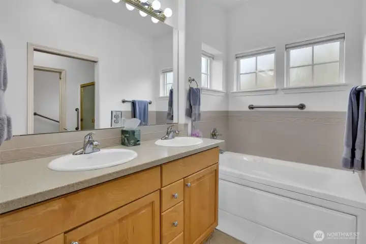 Primary 5-piece bath includes double vanity, jetted tub and step-in shower