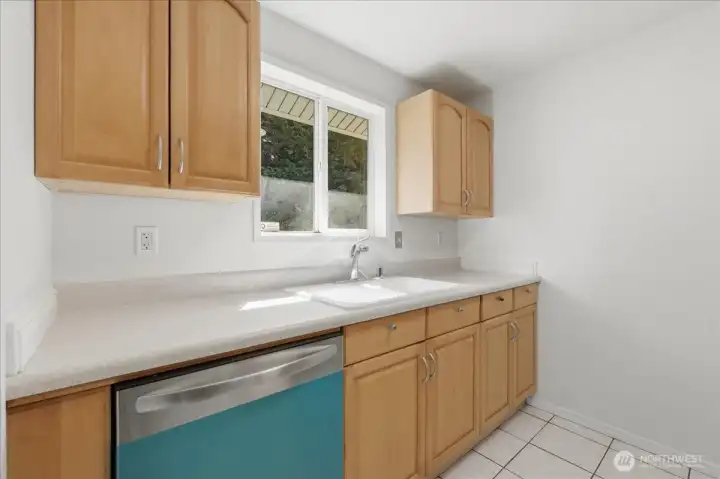 Maple cabinets and vinyl windows!