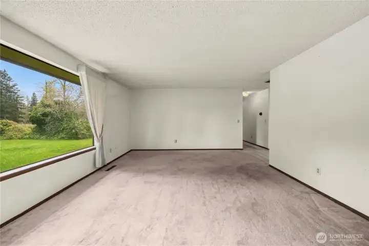Looking from the wood stove toward the entry (on the upper right) and down the hallway toward the bedrooms.
