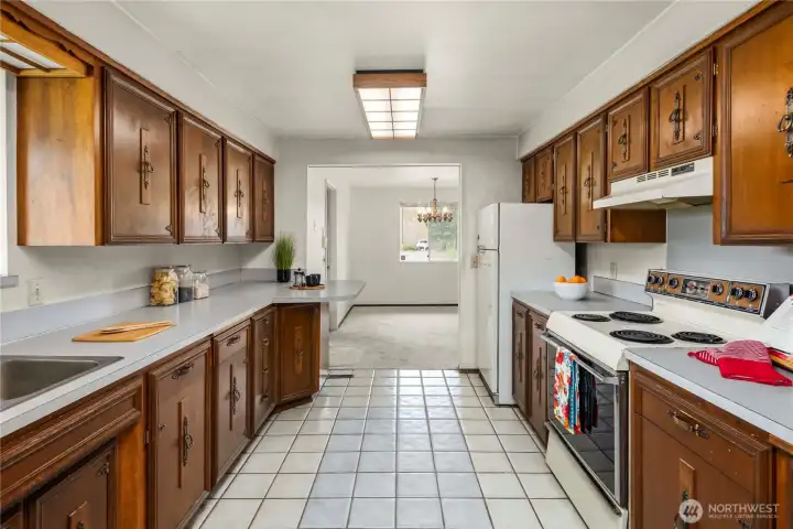 Looking toward the dining room from the entry door side of the kitchen. Opening up the wall on the right would allow for a large island open to the living room - and the view.