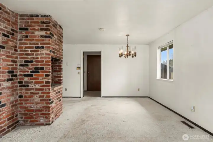 Looking toward the dining room and utility room & garage access beyond.