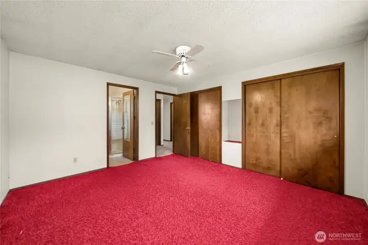 Primary bedroom is complete with two sets of closets and private 3/4 bath.