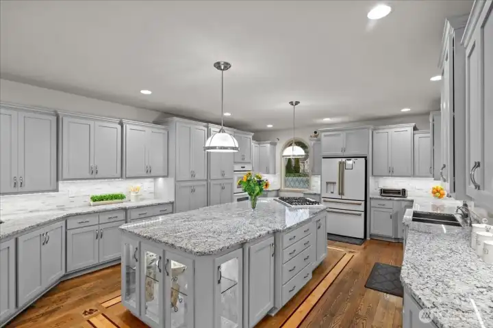 The center island in this beautifully remodeled kitchen measures 11'x5'.