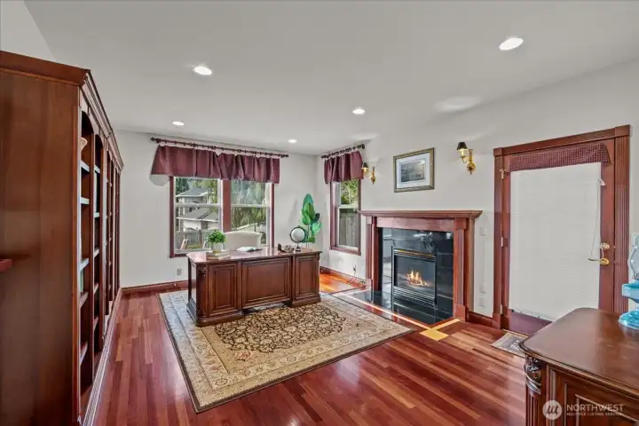 Main floor private office with fireplace & outside access.