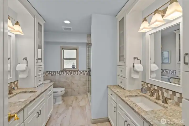 Three quarter bath upstairs, dual vanities with quartz countertops, plus large walk in shower.