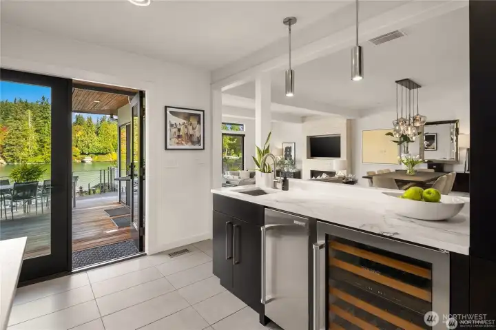 Wet bar is ideal for entertaining with a sink, Subzero ice maker and wine fridge