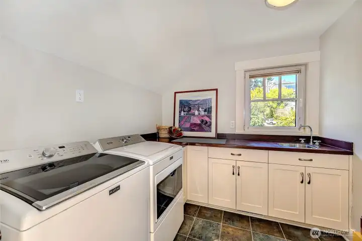 Spacious and convenient upper level laundry.
