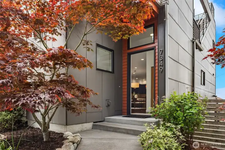 Handsome front entry, perched above the street.