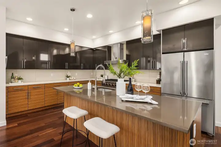 Well appointed kitchen with Wolf range.