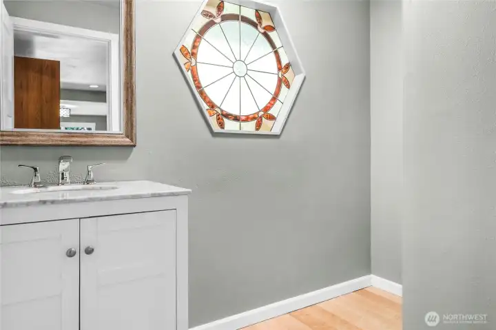 A lovely northwest detail in this remodeled powder room located off the front door and convenient to the main living spaces.
