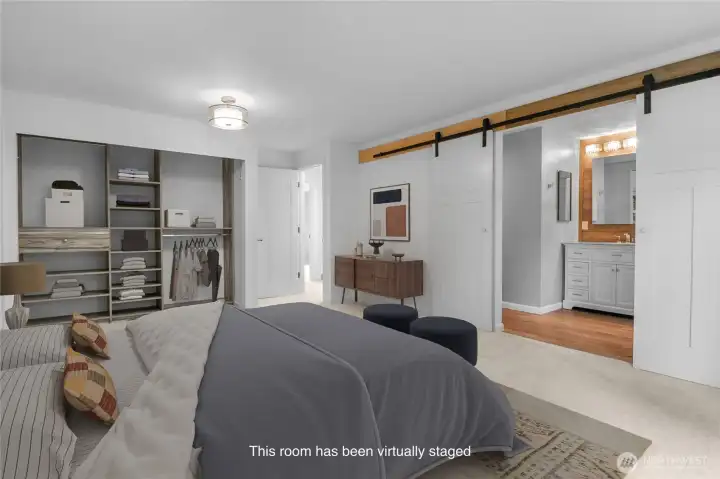Your new primary ensuite. Sliding barn doors provide access to the remodeled bathroom.