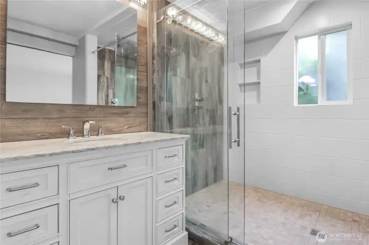 An oversized shower is the star of this primary bathroom's remodel.
