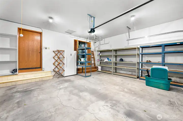 Large 2 car garage with shelving