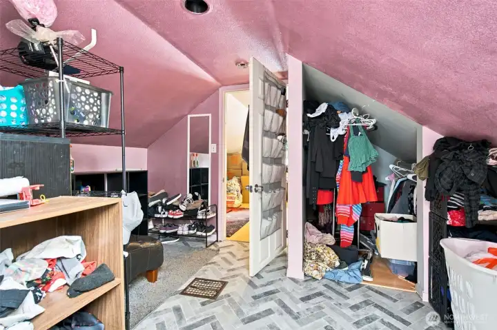 Bright loft bedroom featuring a skylight and peek-a-boo Sound views