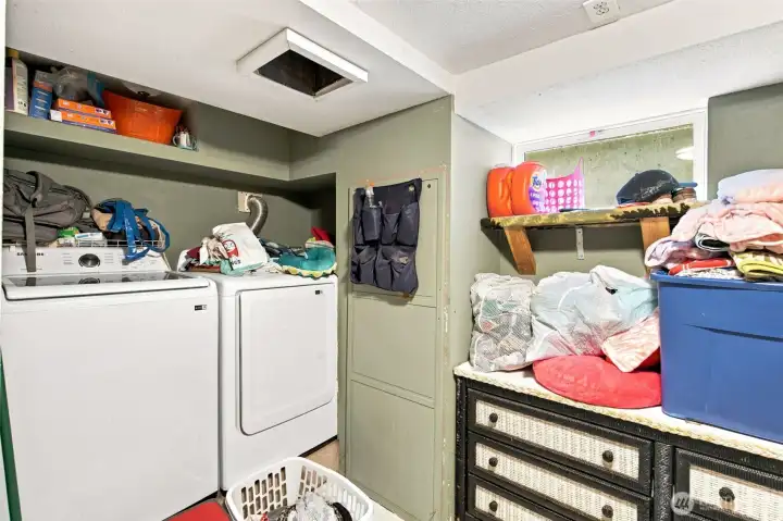 Dedicated laundry space with room for supplies and more