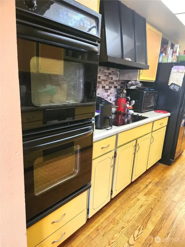 Kitchen with double oven, range, dishwasher