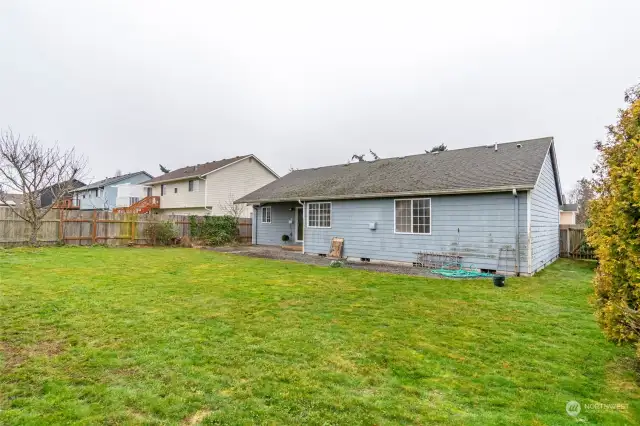 Backyard with gate to front yard.