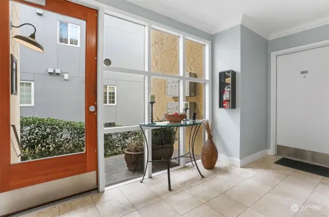 Lobby entrance and unit front door.