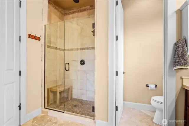 en-suite bathroom shower and separate toilet room left