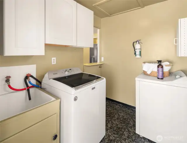 Conveniently located off the kitchen, the laundry room is perfect for tackling chores without leaving the heart of the home. Plus, the door leads right out to the backyard—because who doesn’t love easy access to fresh air while folding laundry?
