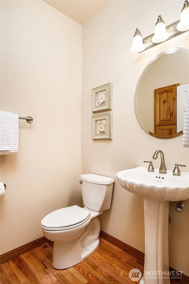 Centrally located Powder Room.