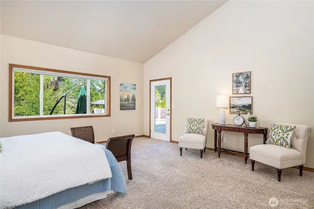Primary suite has direct access to the deck. Enjoy your morning coffee while listening to the birds.