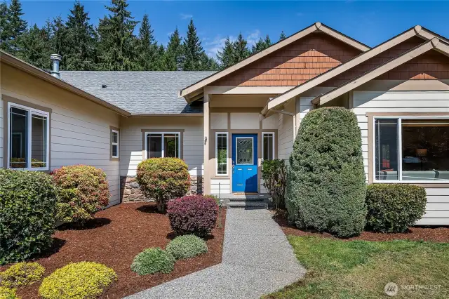 Beautiful beds flank the entrance.