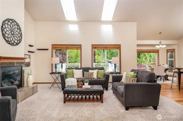 Family Room looking out towards the deck.  and backyard. Double skylights overhead bring in lots of light.