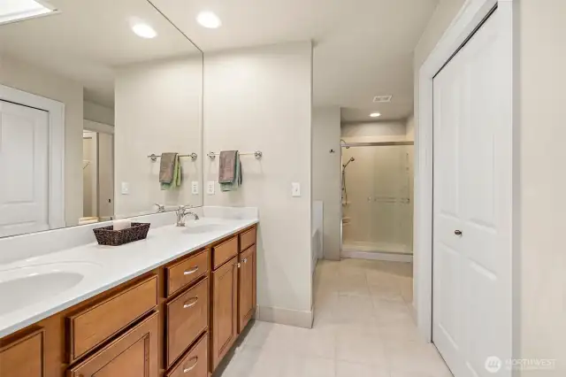 Spacious en-suite bath with large linen closet.