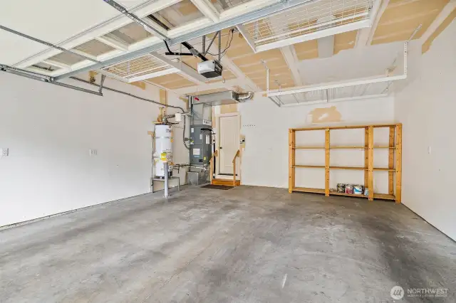 Attached, 2-car garage with additional hanging storage racks.  All storage racks stay!