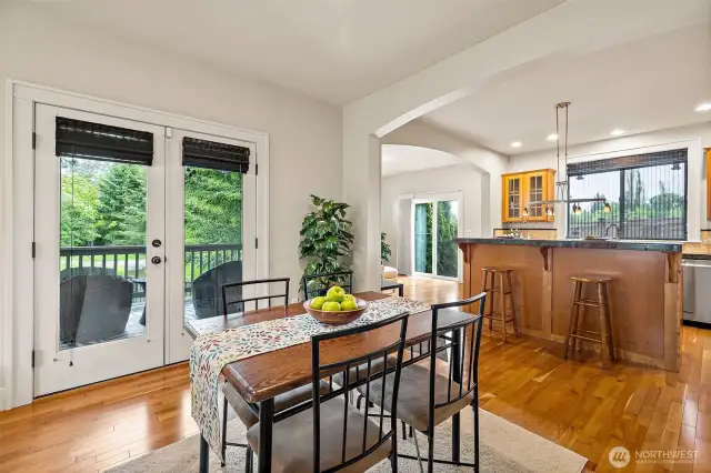 French doors lead to the main level patio that overlooks the pond and wetlands.